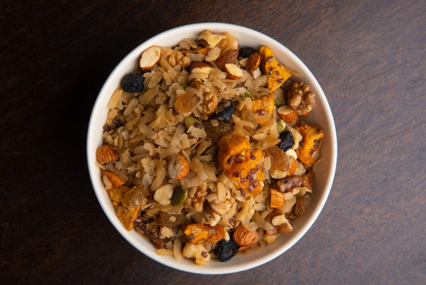 300 g pack of Bakul Phool Brown Rice Muesli – healthy breakfast blend with crunchy brown rice flakes and real dried mango pieces.