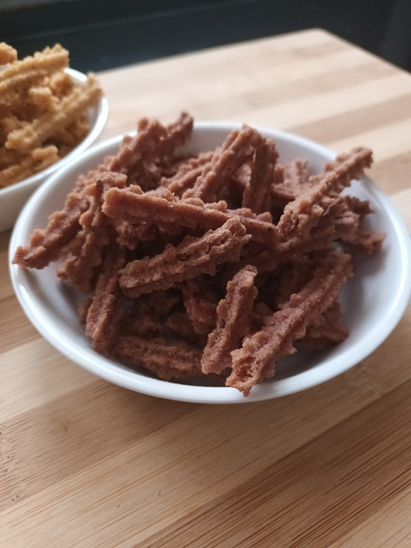 Kaatuyaanam Red Rice Murukku – crispy, handmade South Indian snack made with nutritious red rice, perfect for guilt-free snacking