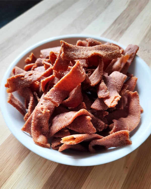 Kaatuyaanam Red Rice Ribbon Pakoda – crunchy, ribbon-shaped snack made from heritage red rice, offering a wholesome twist to a traditional favorite